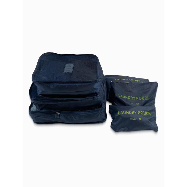 Set of navy blue packing cubes and laundry pouches on a white background