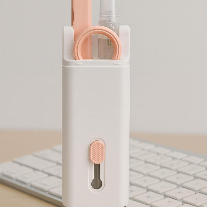 White and pink tech cleaning kit on a light gray background