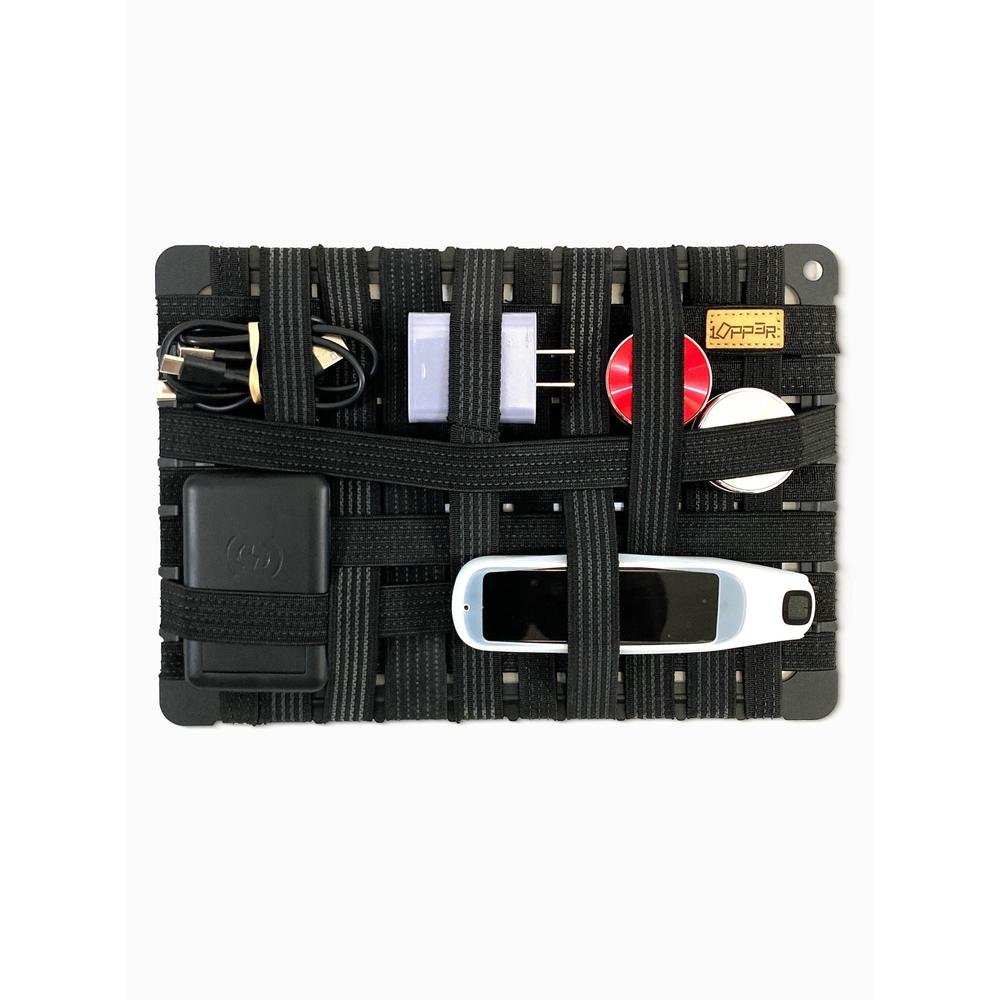 Black alloy frame organizer case with various electronic tools on a white background