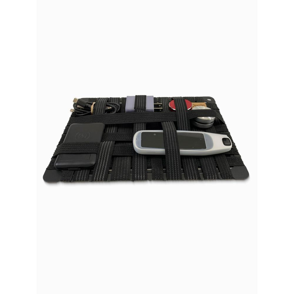 Alloy frame organizer case with various small tech items on a white background