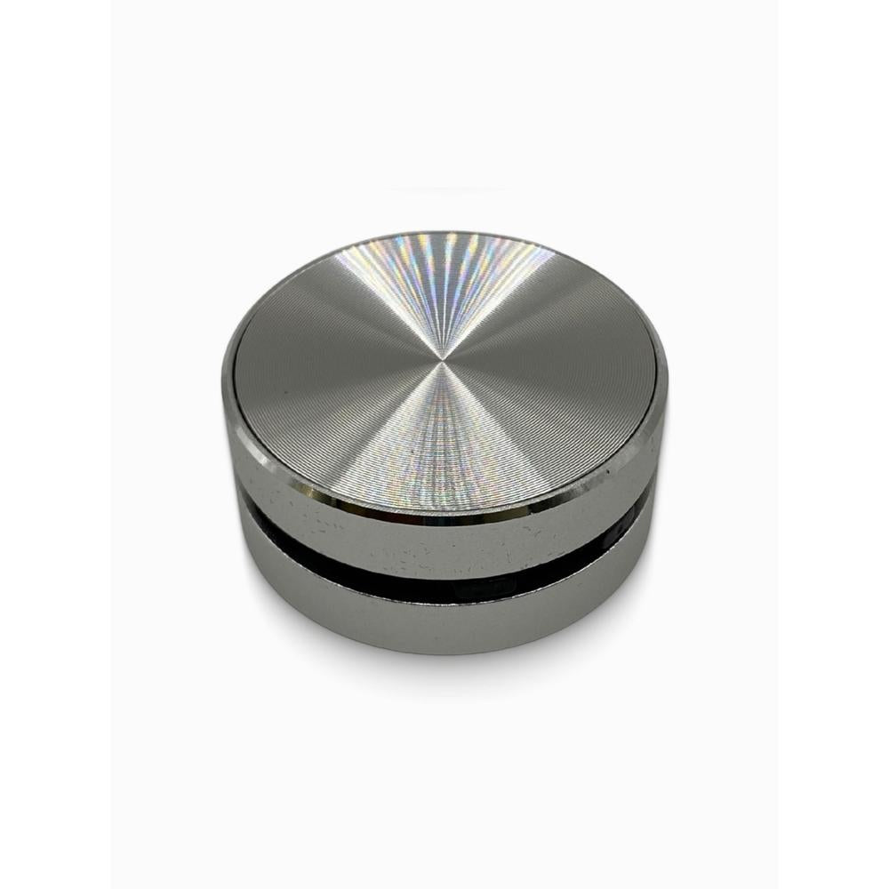 Silver bluetooth speaker with reflective surface on a white background
