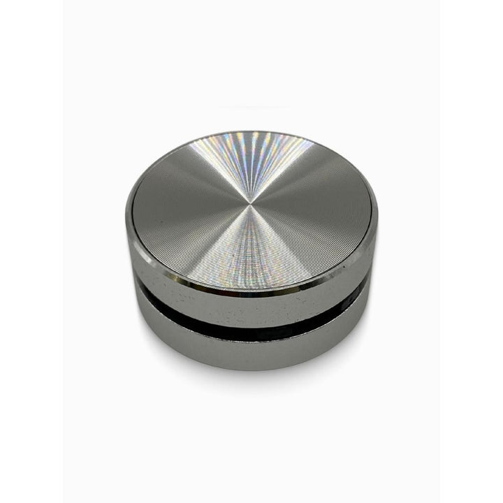 Silver bluetooth speaker with reflective surface on a white background