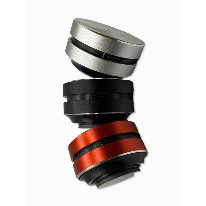 Stack of three bluetooth speakers on a white background