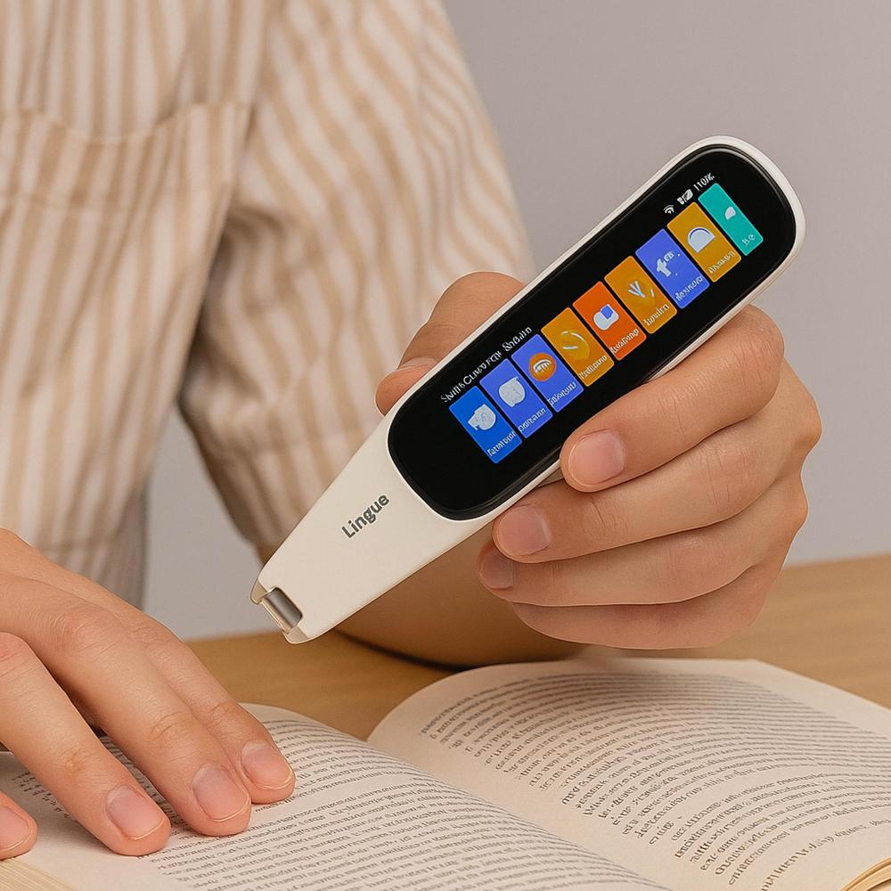 Person using a language translating device with colorful app icons on a book