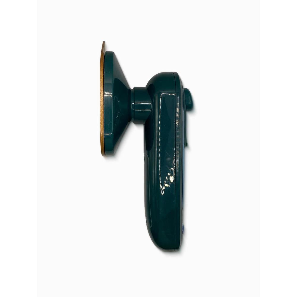 Green portable travel iron on a white background