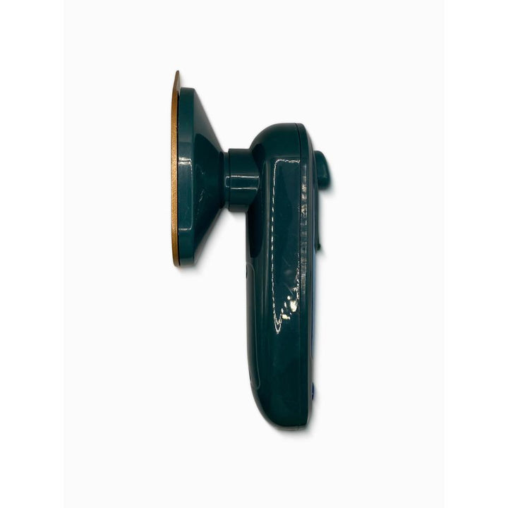 Green portable travel iron on a white background