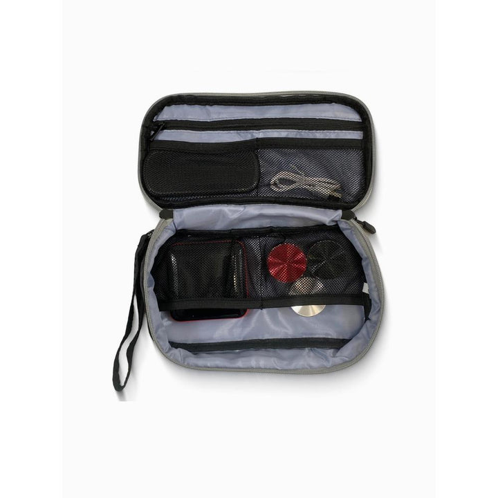 Gray travel pouch with black interior compartments on a white background