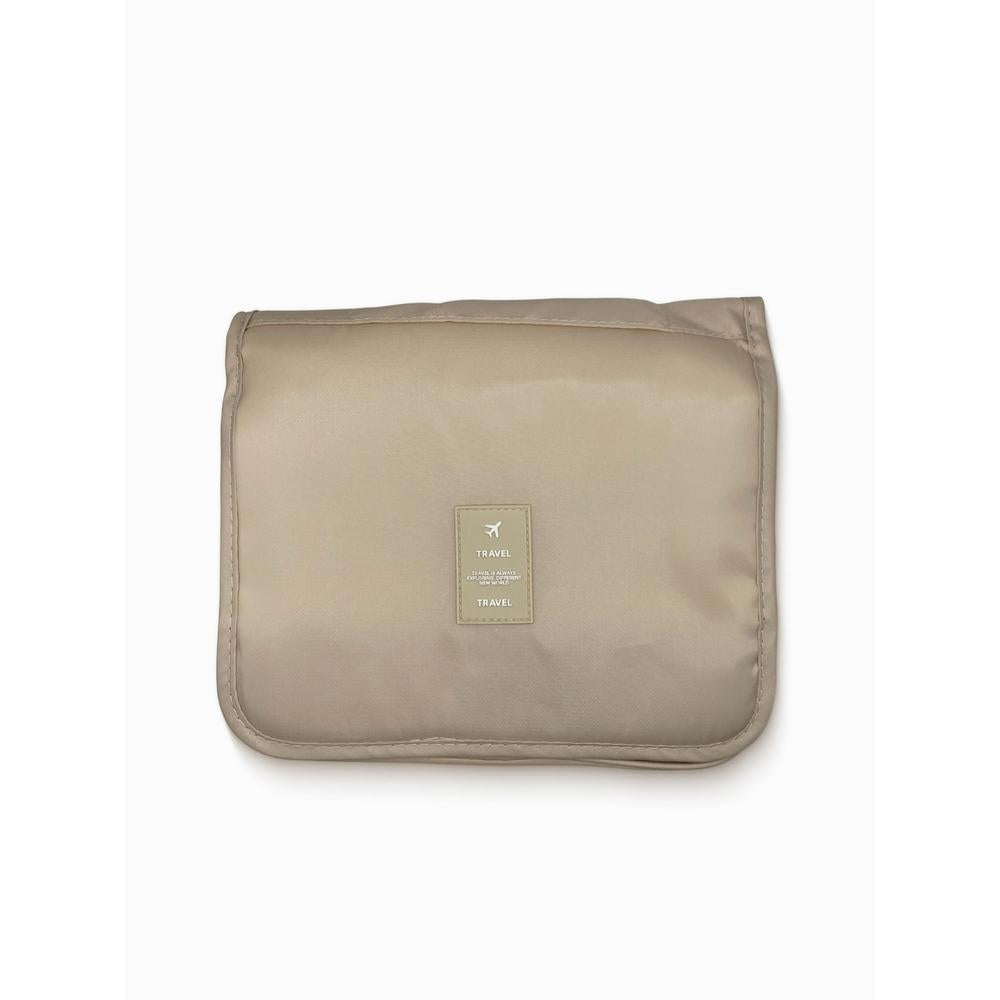 Beige travel pouch with a brand label on a white background