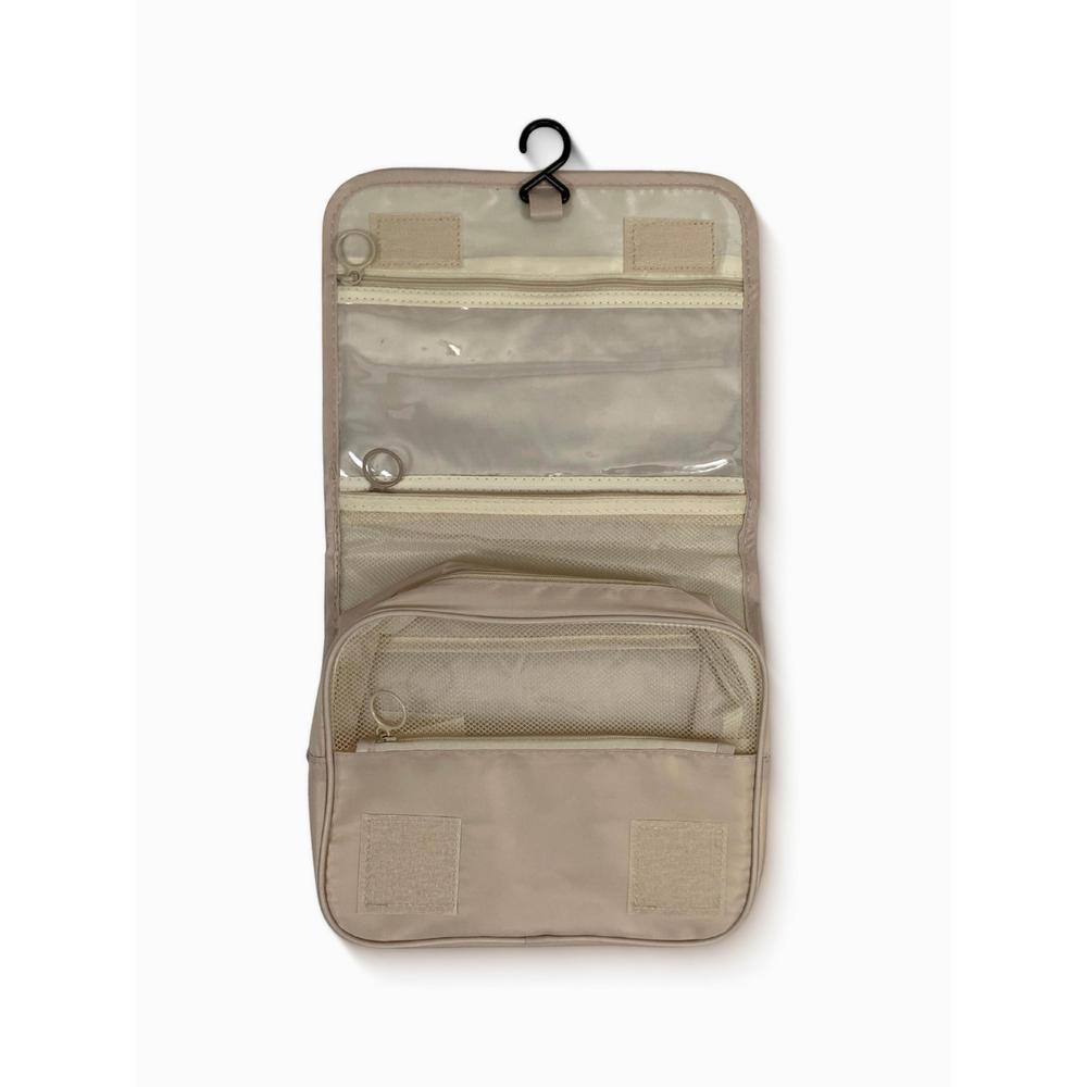 Beige travel organizer with multiple pockets on a white background