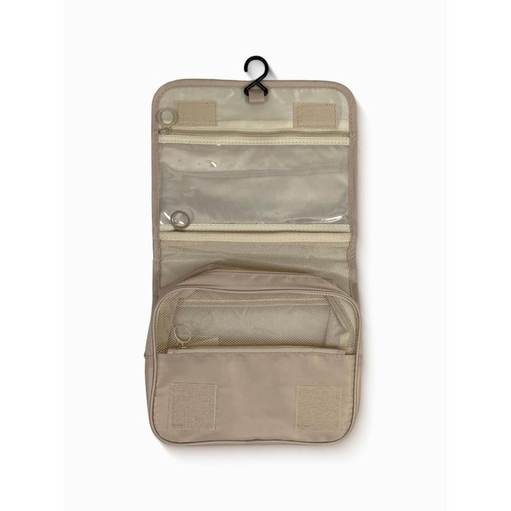 Beige travel organizer with multiple pockets on a white background